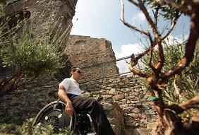 accessible tourism image of wheelchair user in natural landscape by CPD, Italy