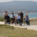 Photo of wheelchairs on path by sea, Cyprus