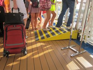 Image of ramp and suitcase with wheels at Barcelona passenger port by John Sage