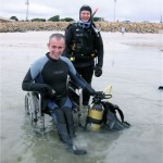 Photo Wheelchair user in scuba gear on beach, Catherine Mack