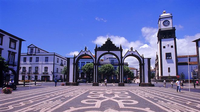 View of Ponta Delgada, cobblestone square and heritage gateway 