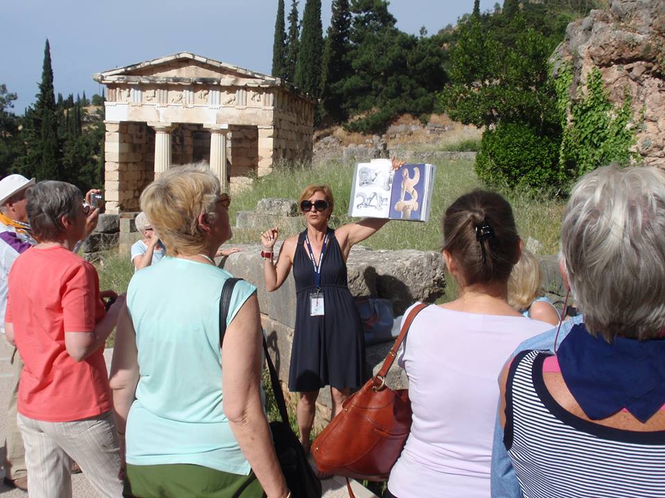 Image of Tourist Guide with group of clients at Delphi