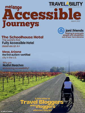 Accessibel Journeys Cover with wheelchair user on open road between fields of grape vines 