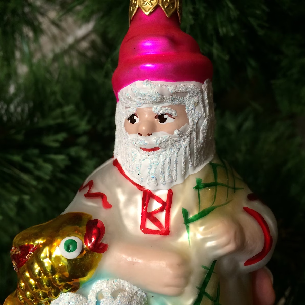 Image of coloured glass Santa Claus bauble on a Christmas tree