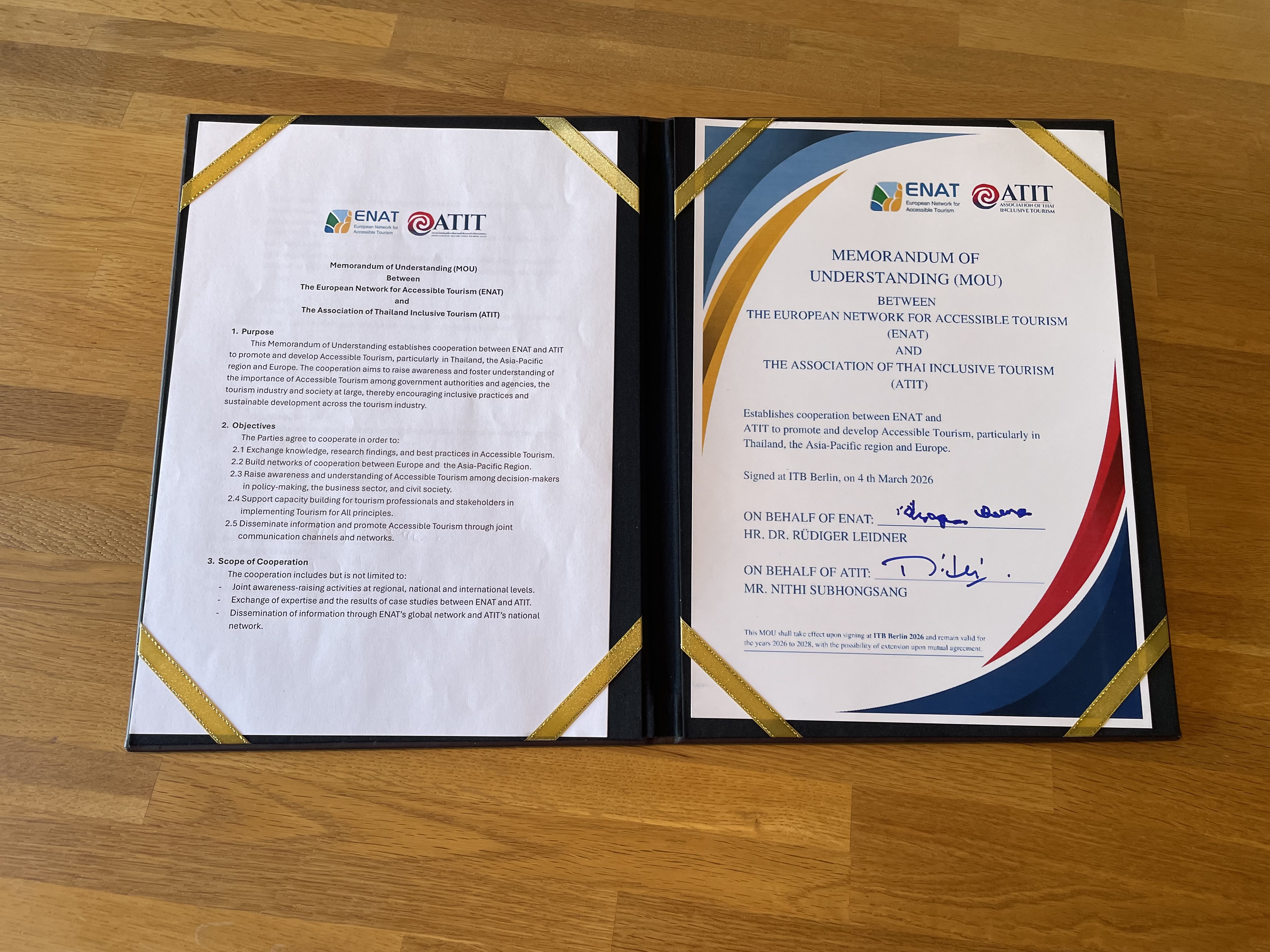 Image of an open folder with 8 gold bands containing Memorandum pages with text on left and signed certificate on right.
