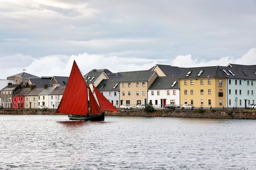 Image of a traditional, gaff-rigged Galway Hooker sailing boat, a common sight in Galway Bay.  